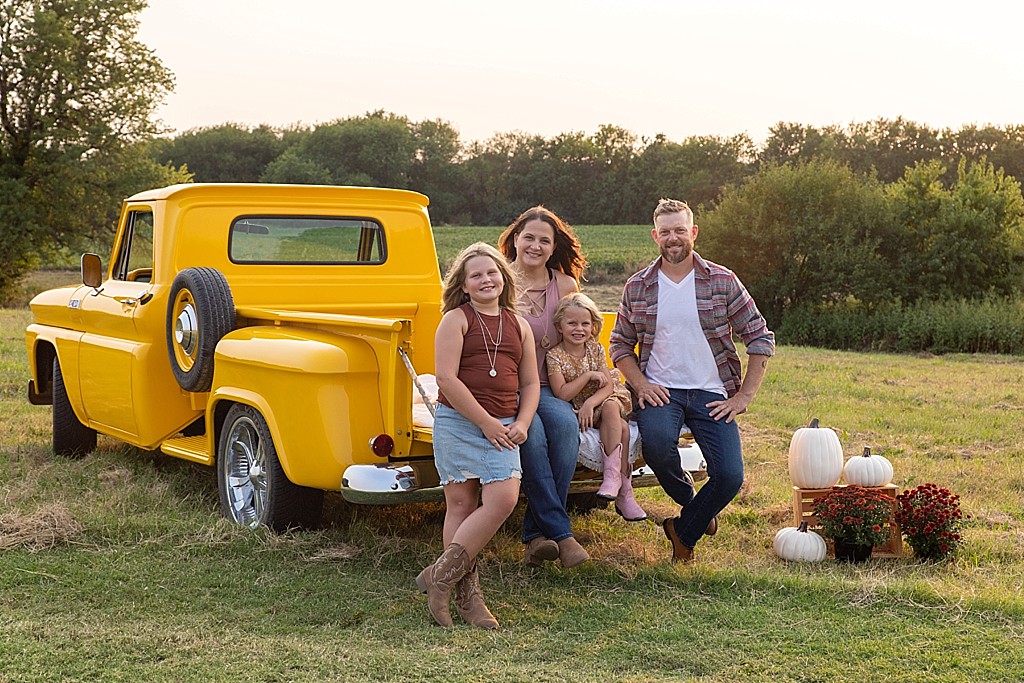 family photo session with vintage yellow truck