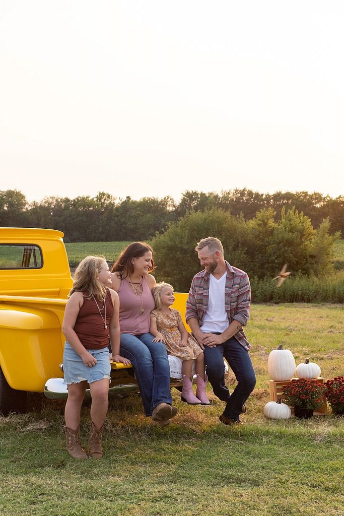 family photo session with vintage yellow truck