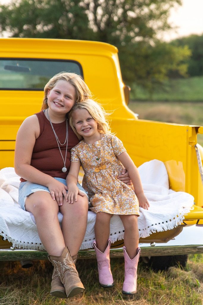 family photo session with vintage yellow truck