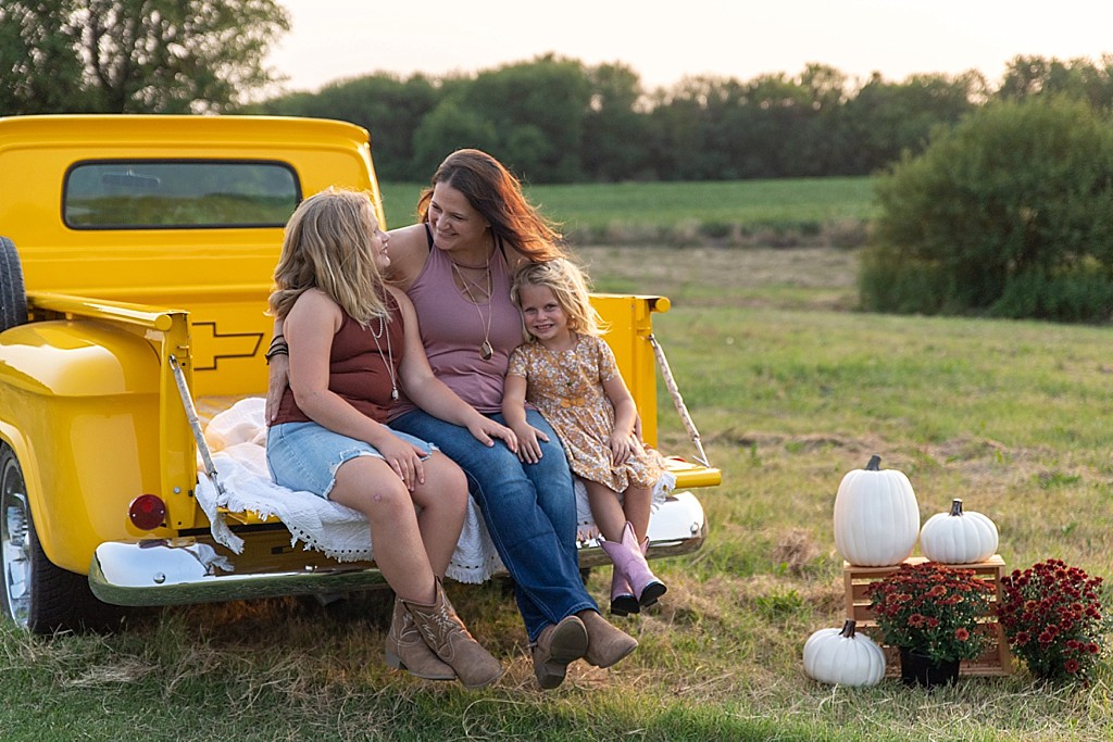 family photo session with vintage yellow truck