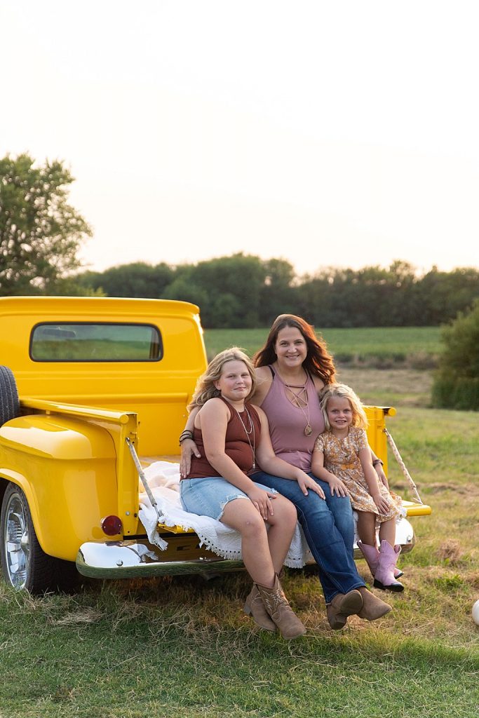 family photo session with vintage yellow truck
