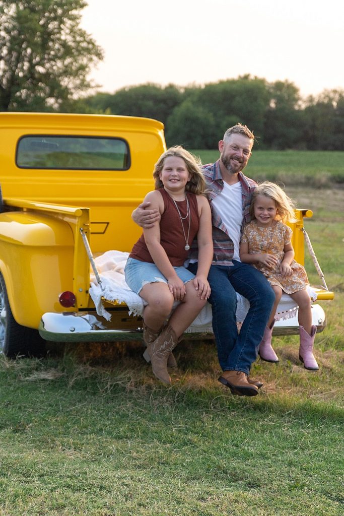 family photo session with vintage yellow truck