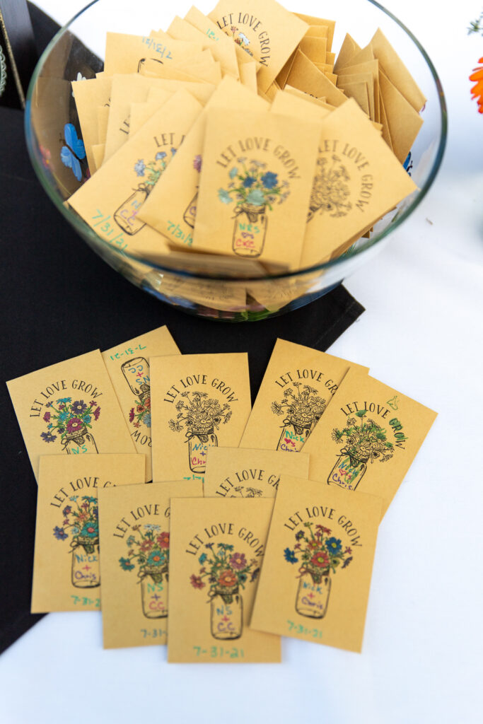 packs of flower seeds as wedding favor at backyard wedding
