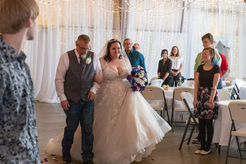 bride and her dad walking down the aisle