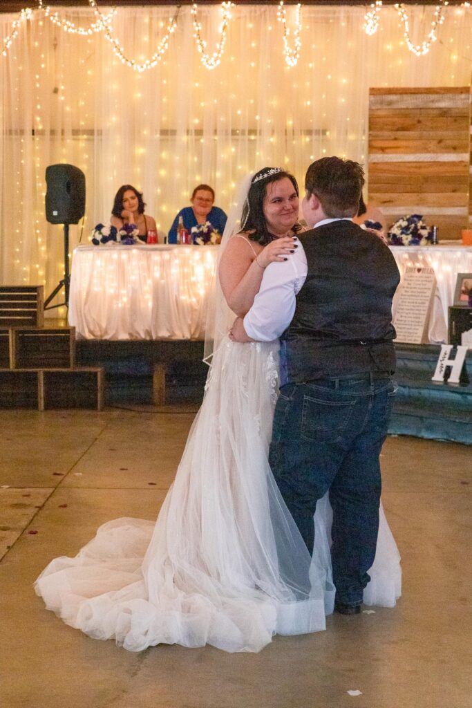 bride and groom first dance at lakeside wedding venue
