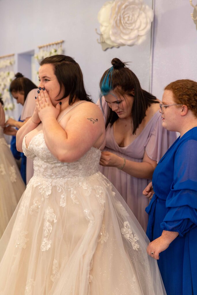 bride with bridesmaids at lakeside wedding venue