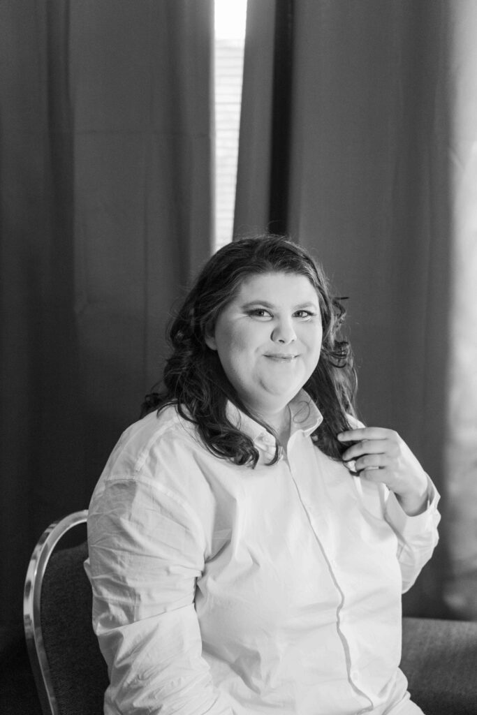 black and white photo of bride getting ready