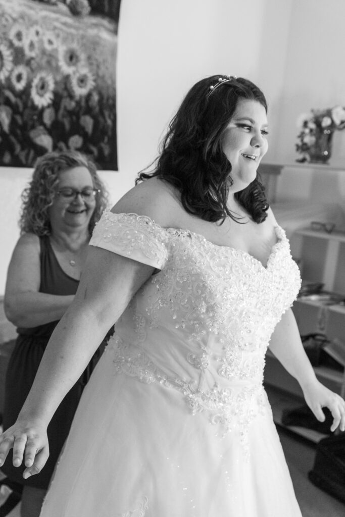black and white photo of bride getting ready with mom