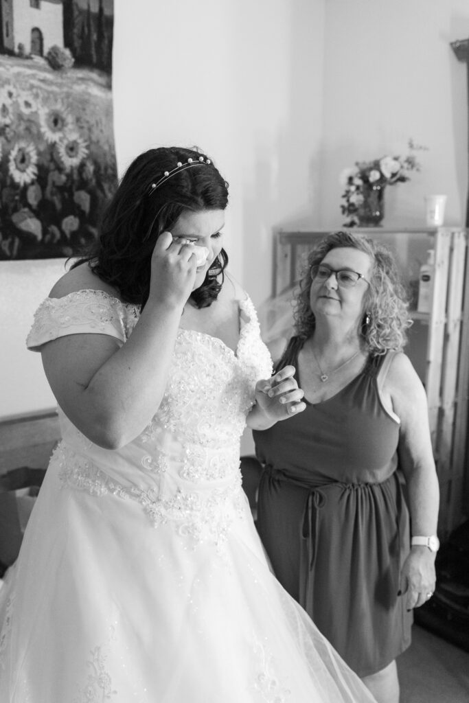 black and white photo of bride getting ready with mom