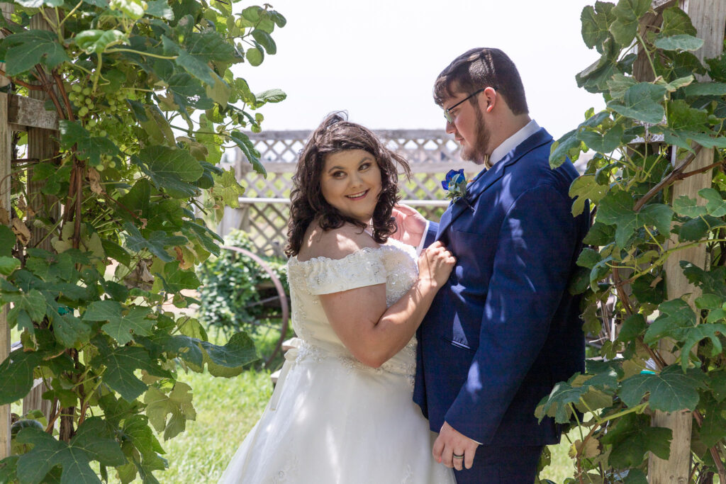 bride and groom in vineyard at summer wedding