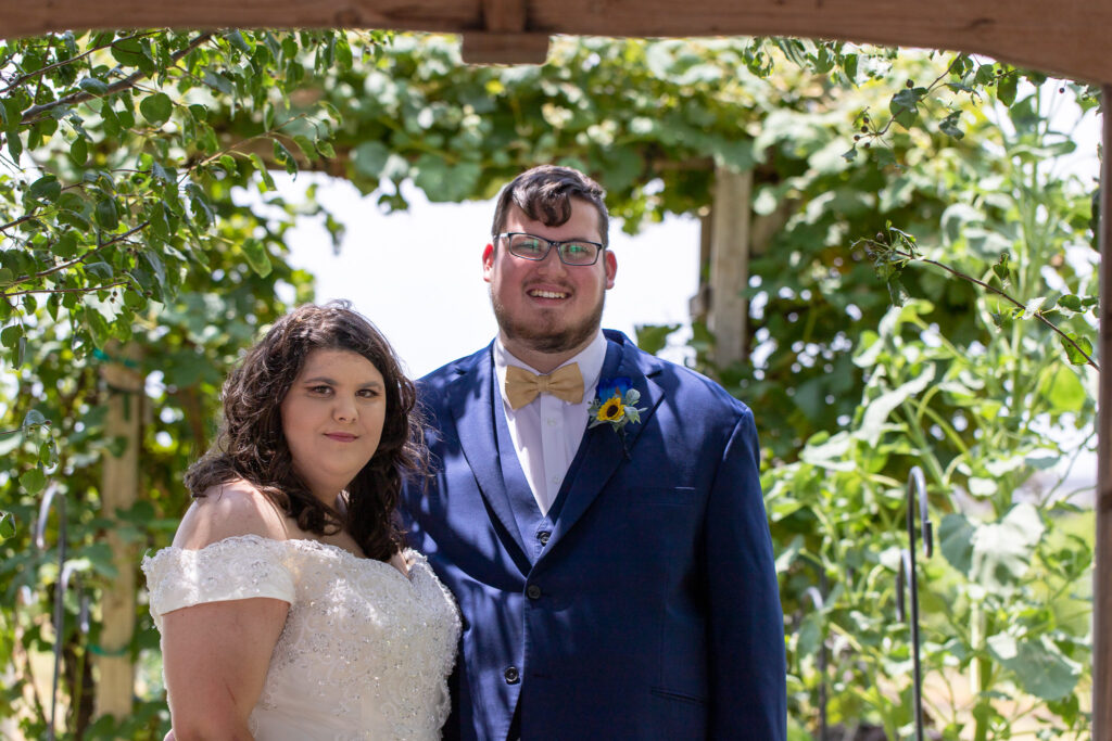 bride and groom in vineyard at summer wedding