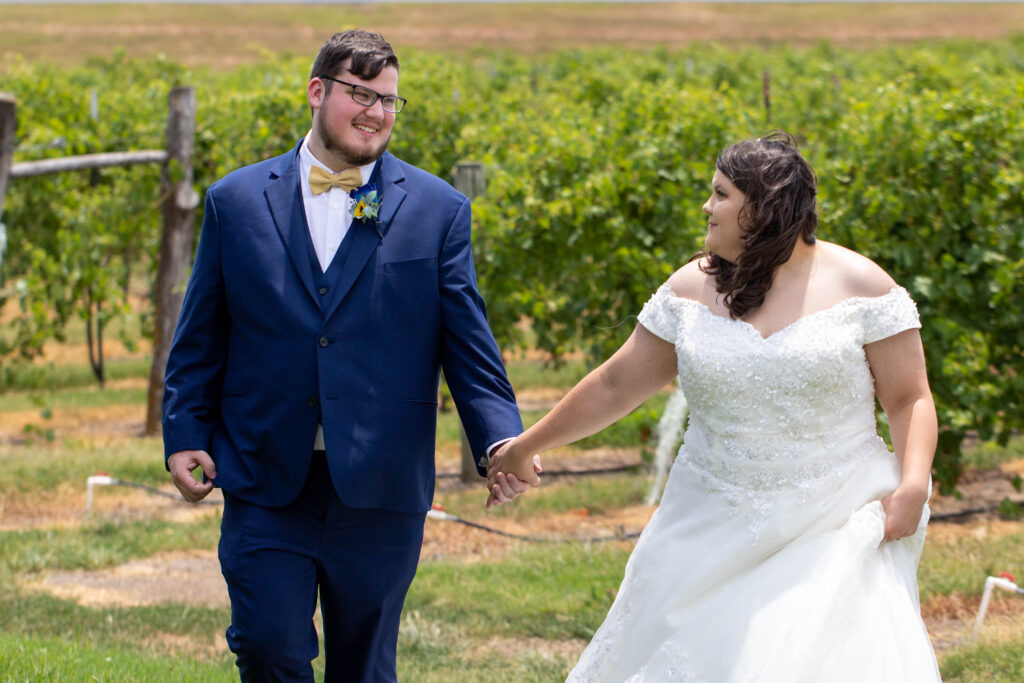 bride and groom in vineyard at summer wedding