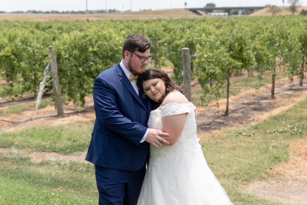 bride and groom in vineyard at summer wedding