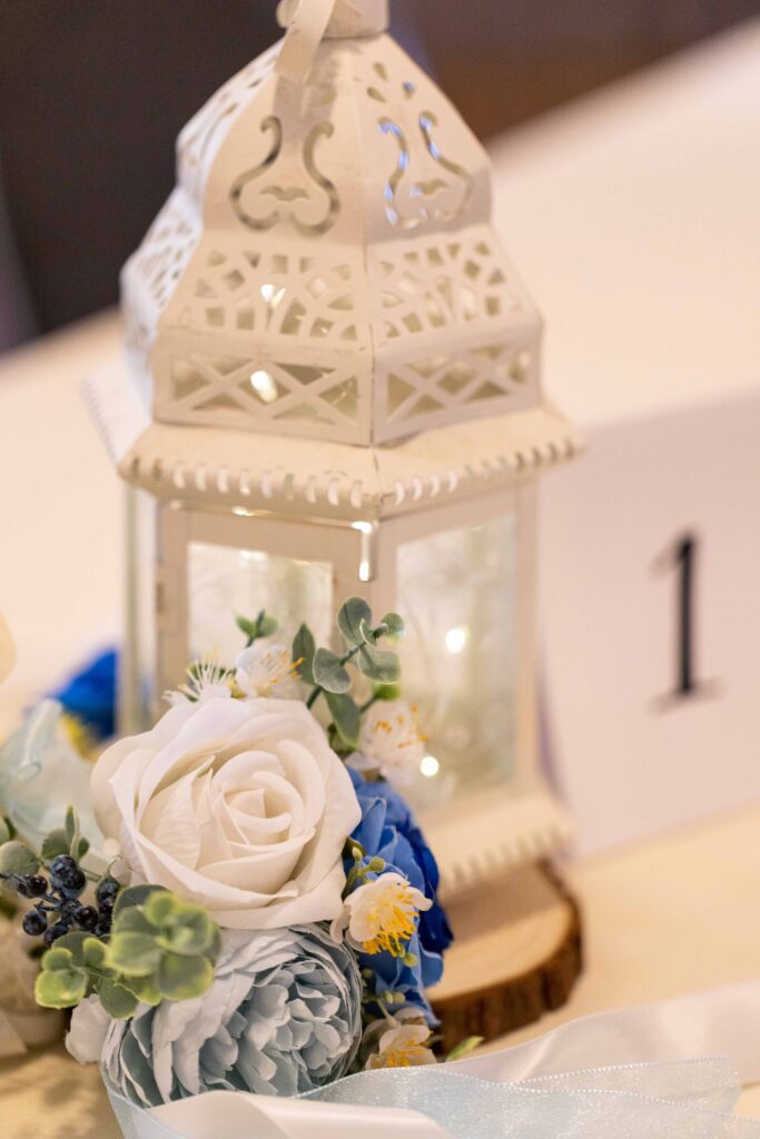 white and blue wedding reception centerpiece