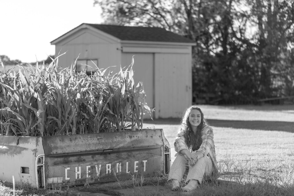 black and white photo of senior with old chevy truck bed