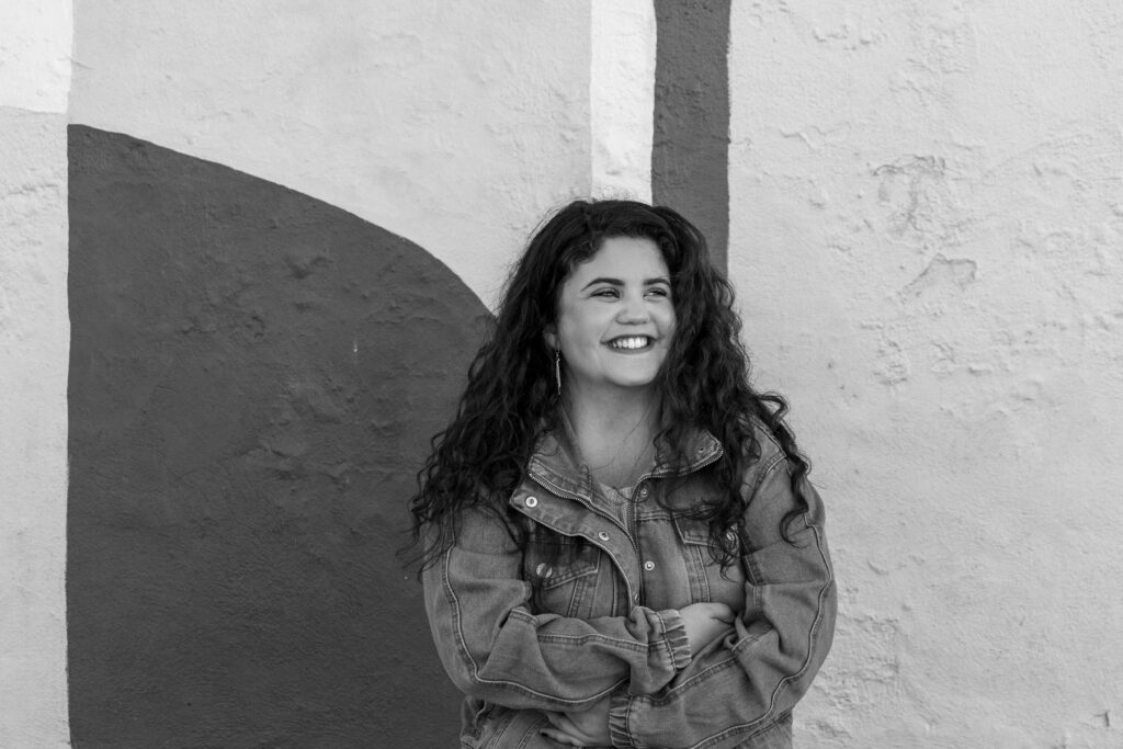 black and white photo of senior girl at downtown hutch senior session