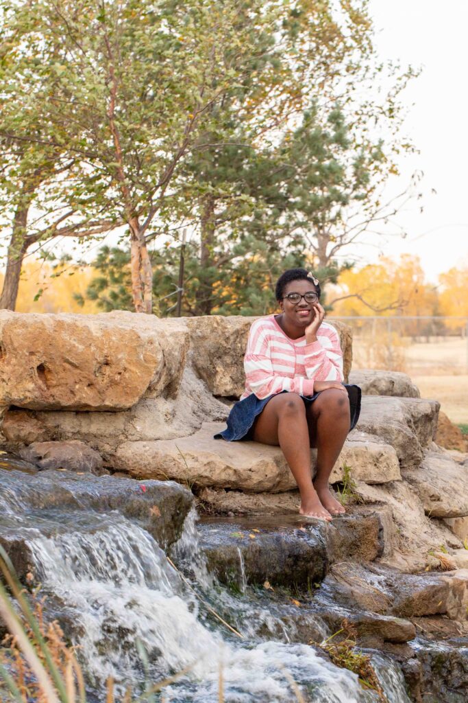 Valley Center High School Senior girl fall photo near waterfall
