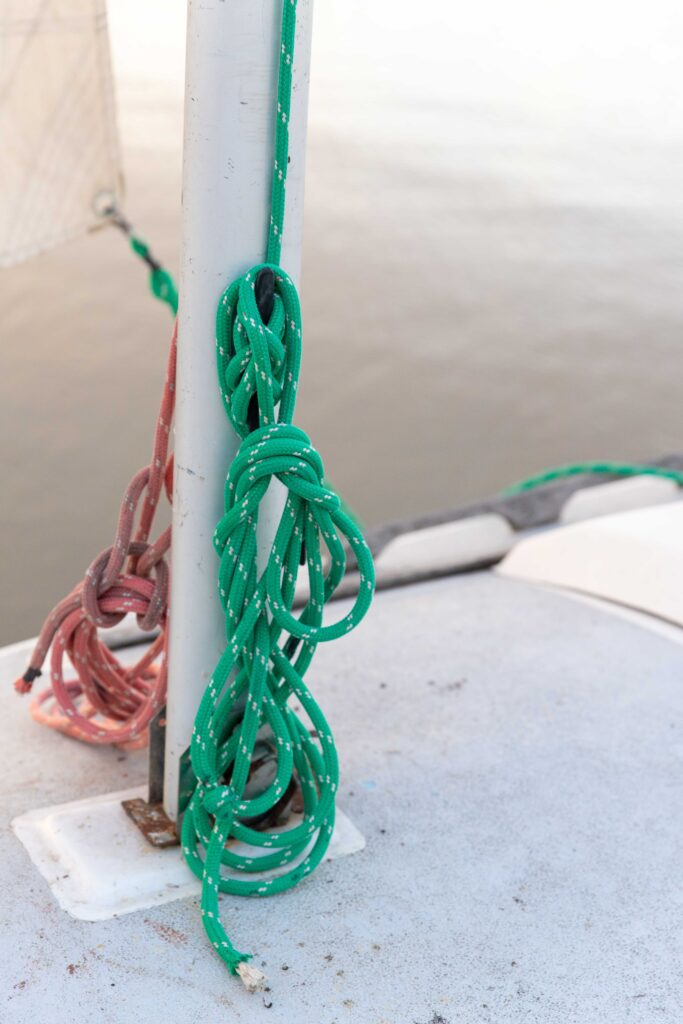 green and red ropes on boat dock at senior girl photo session